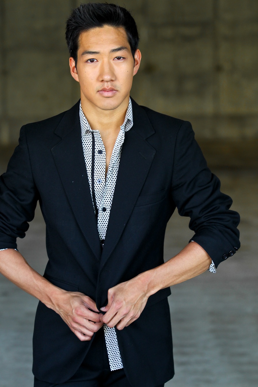 Headshot of Alex Wong in a dark blazer